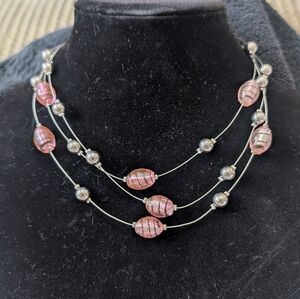multi-strand pink and silver-toned beaded necklace,